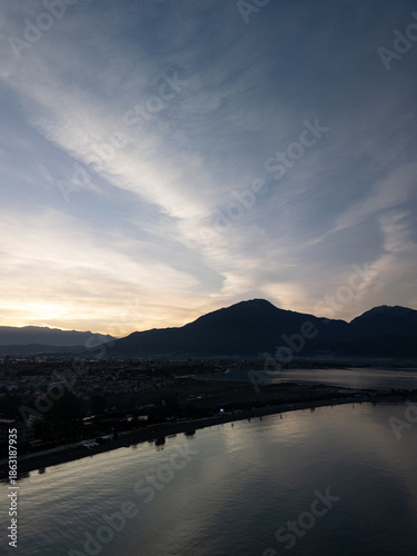 Aerial panoramic shot of foggy mountain valley during morning golden hour