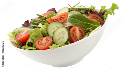 Fresh mixed green salad with vegetables in white bowl