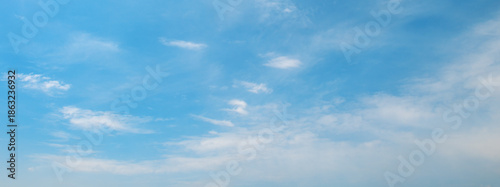 Sky panorama with fluffy and thin clouds creating dynamic texture and contrast across open aerial view