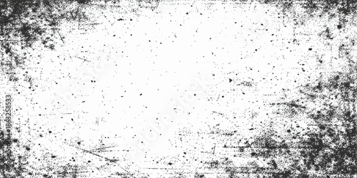 A textured grey stone wall features a dirty grunge pattern with black ink splashes and paint drops on an old paper surface