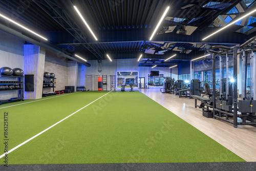 Modern Gym Interior with Exercise Equipment and Artificial Turf Track