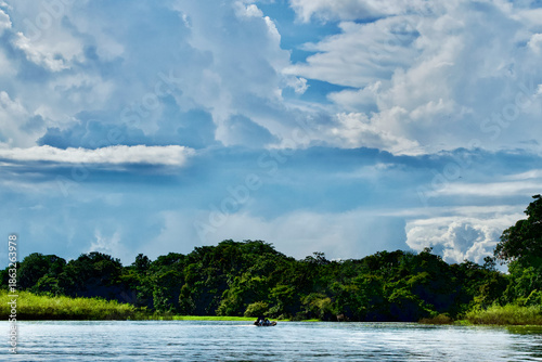 Boat sailing on an arm of the Amazon River near Puerto Nariño in Colombia.