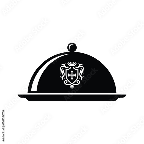 Elegant black serving platter with ornate crest a symbol of fine dining