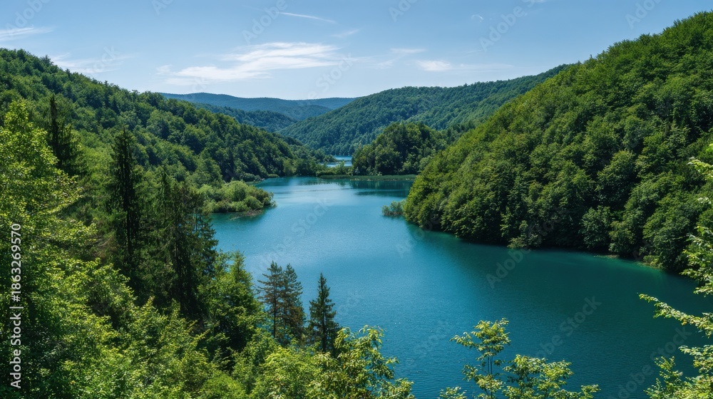 Fototapeta premium scenic landscape of a stunning turquoise lake surrounded by lush green forests in the picturesque region of plitvicka jezera croatia