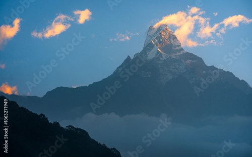 Summit of Machhapuchhre mountain seen on the trail to Mardi Himal Base Camp in Annapurna Region of Nepal.