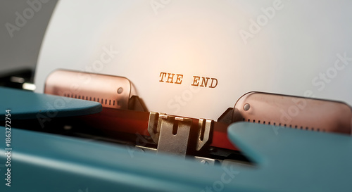 The End typed on a vintage typewriter signaling conclusion or completion of a project