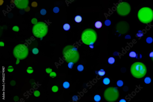 Abstract Green And Blue Bokeh Lights In Night Sky With Soft Glows