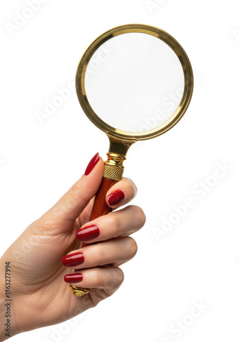 professional photorealistic macro of a caucasian woman's slender hand with glossy oxblood nails holding a vintage golden brass magnifier on white. concept of detailed analysis