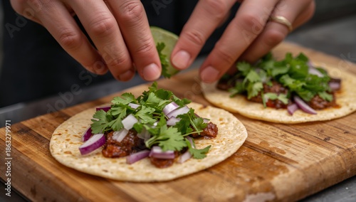 Hands Prepare Tacos With Toppings on a Wooden Board in a Kitchen Setting Duri...