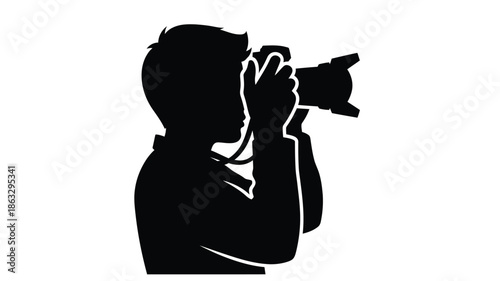 A silhouette of a person holding a camera possibly a photographer in action