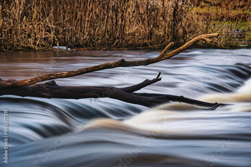 Schilderij op canvas Ethereal Long Exposure of Vahiküla Waterfall Cascading Through the Estonian Wild