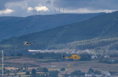 Summer wildfire, where helicopters are working non-stop dropping water!