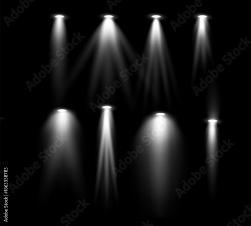 Illuminated Brilliance: A collection of spotlights illuminate the darkness, casting beams of light against a black backdrop. The scene evokes a sense of drama, focus, and illumination.