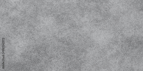 A seamless grey paper and fabric texture features a rough grunge pattern on a blank stone surface backdrop for a light old canvas design. Abstract black and white marble texture background. Old grunge