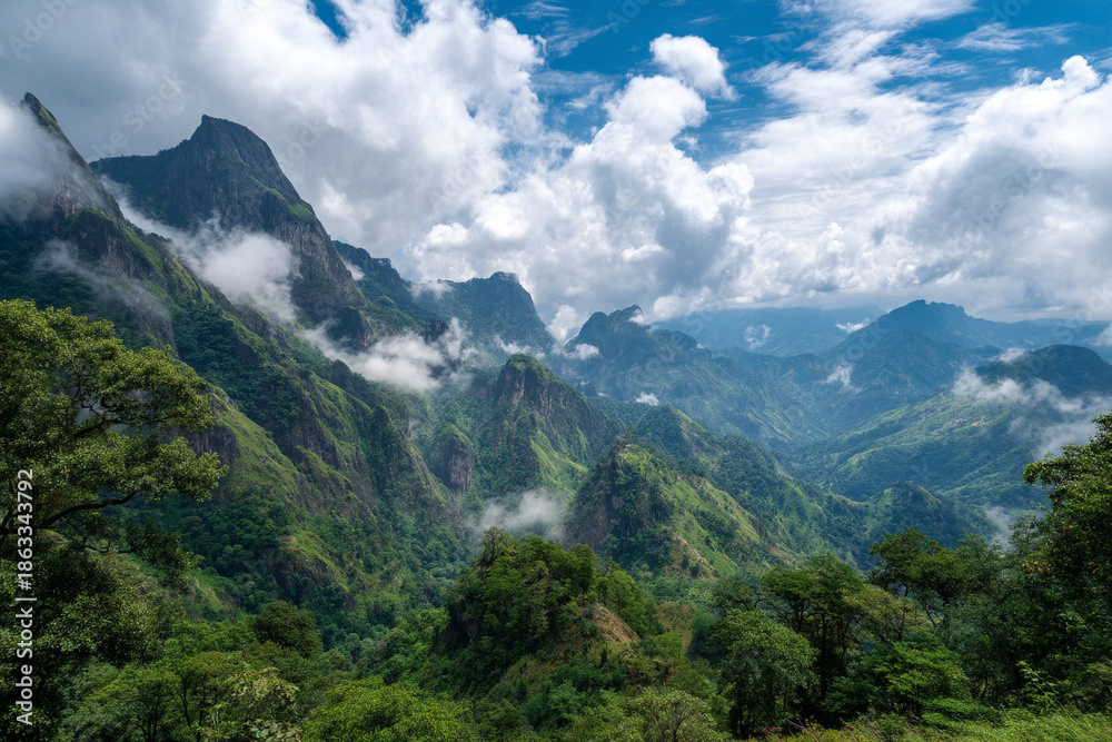 Fototapeta premium The dramatic, lush peaks of the Sierra Madre de Chiapas, showing cloud forests and coffee plantations under a vast sky.