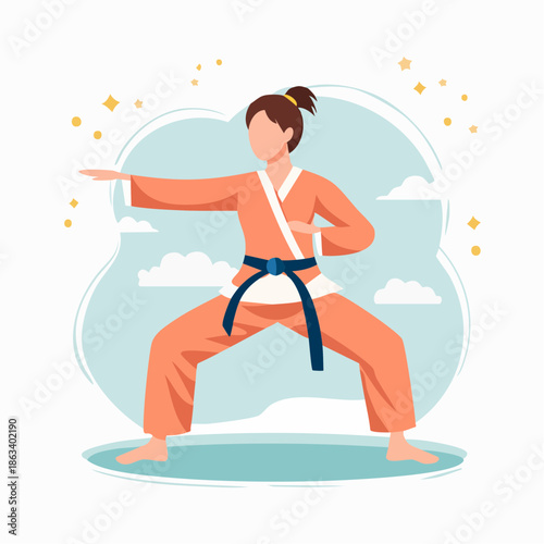 Woman in Karate Stance Wearing Orange Gi and Blue Belt.