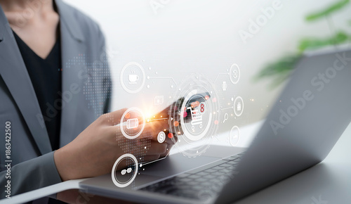 Fotografie Business professional using laptop with digital shopping interface showing onlin