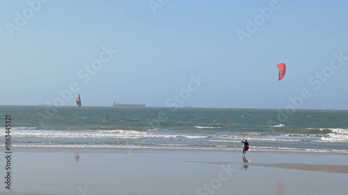 Some people practicing kitesurfing on Olho d'Água beach, in São Luís, Maranhão, northeastern Brazil.