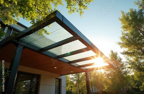 Modern home extension features clear corrugated polycarbonate roofing for carport patio. Sunlight streams through transparent material creating bright outdoor living space. Durable, weather resistant.