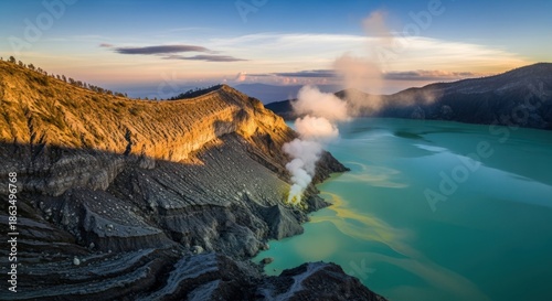 Kawah Ijen Volcano Crater Lake at Sunrise with Sulfur Fumes and Golden Light, East Java, Indonesia