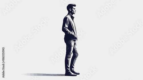 A man in casual attire stands with his hands in his pockets, looking to the side with a slight smile.