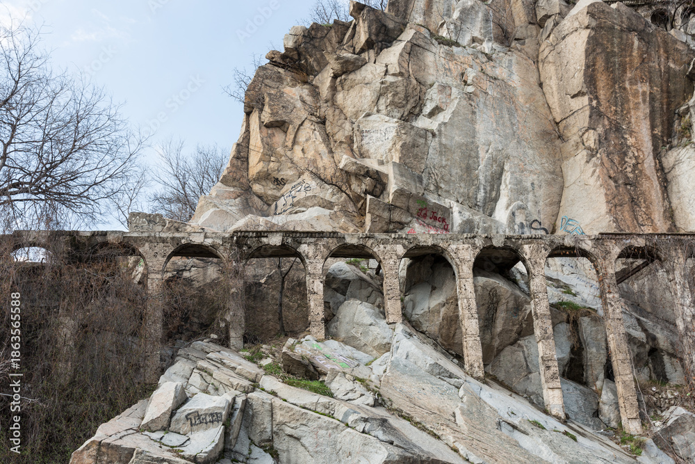 Fototapeta premium Old ruins in the rocks with sky and clouds on Markovo tepe. Plovdiv