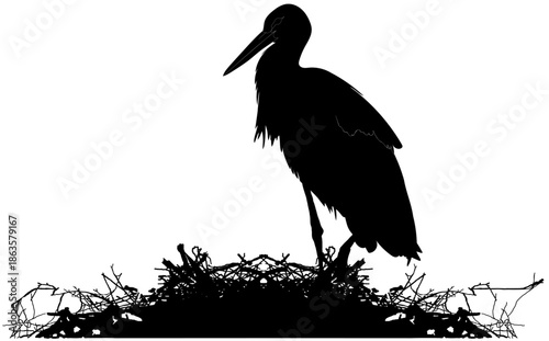 stork silhouette standing on a nest silhouette in black and white vector