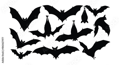 A collection of black bat silhouettes in various flying positions