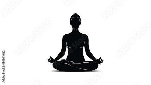 Silhouette of a person meditating in lotus position
