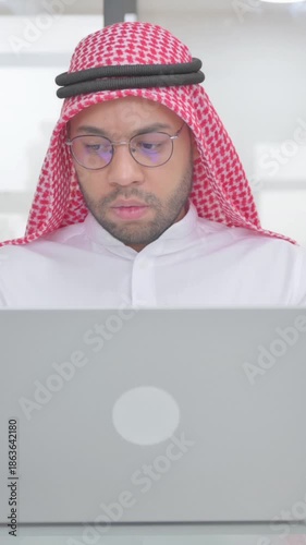 Young Muslim Man Enjoying Online Banking with Credit Card, vertical video