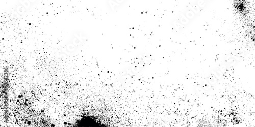 A grainy abstract black and white texture showcasing scattered dark specks against a predominantly white background resembling noise
