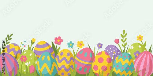 A festive row of brightly colored Easter eggs peeking from lush green grass accented by small spring flowers