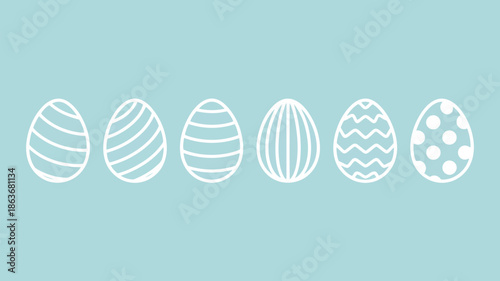 Collection of six white decorated Easter eggs symmetrically arranged on a soothing light blue canvas