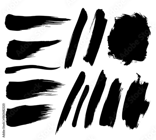 A collection of abstract black brush strokes and paint splatters against a bright white background