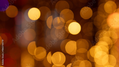 City Light Bokeh With Warm Tones, Street Reflections And Blurred Traffic Highlights Creating Moody Urban Holiday Atmosphere For Commercial Backgrounds And Seasonal Promotions.
