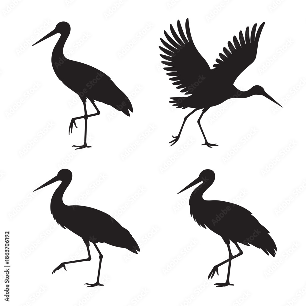 Fototapeta premium Four black silhouettes of cranes in different poses on a white background