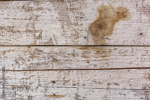 Detailed close up of rustic wooden planks with natural grain, rough texture, scratches, and weathered surface. Perfect background for design projects, vintage decor, carpentry, and creative artwork.