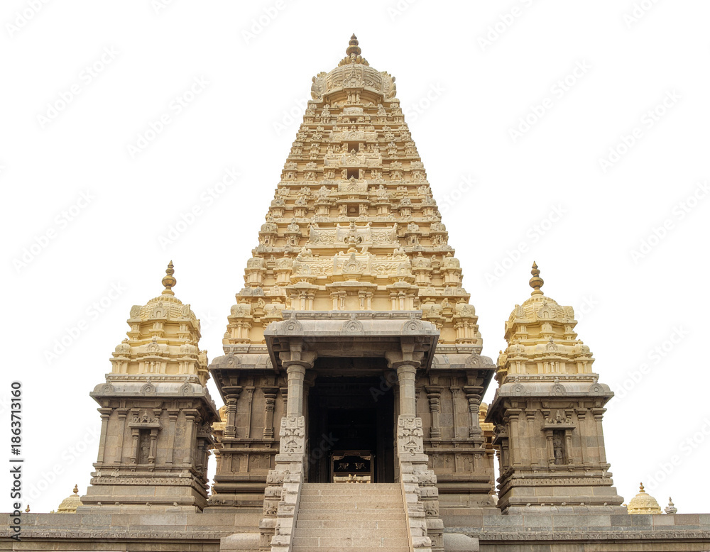 Fototapeta premium Ancient indian temple structure with ornate carved gopuram rising above stone steps