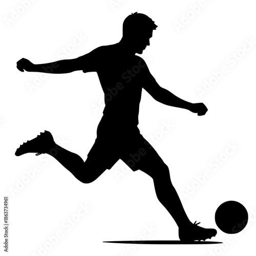 silhouette of a soccer player initiating a strike on the ball from a grounded position