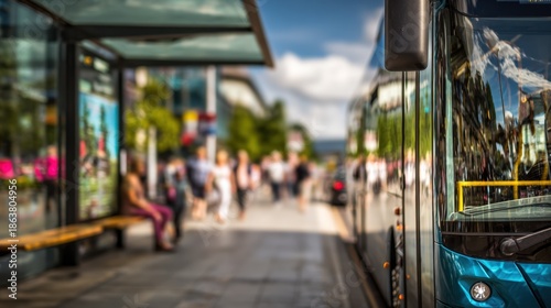 Wallpaper Mural Shot of a zeroemission bus stopped at a clean modern bus stop in a tourist district bus details crisp with lightly outoffocus tourists and colorful surroundings. Torontodigital.ca