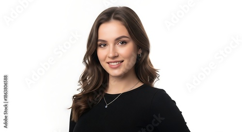 Portrait of a beautiful smiling young woman with long wavy brown hair wearing a black shirt isolated on white background.