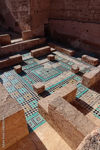 Fotografie Ancient mosaic floor in historic Moroccan courtyard, featuring geometric tile pa