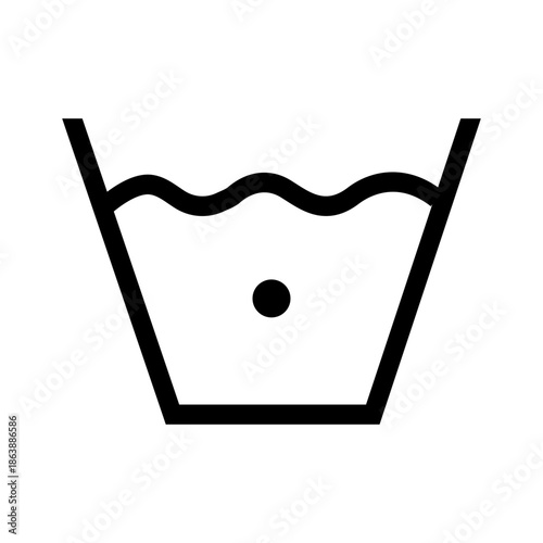 Wash in cold water. Delicate or cold cycle. Clothing marking. Warning symbol. A basin of water with one dot inside. Information about safe washing temperatures on the clothing label.