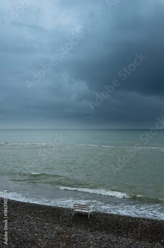 A deserted beach in the face of an approaching storm