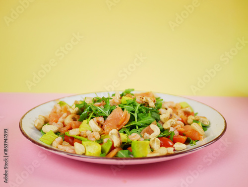 Wallpaper Mural Side view salmon shrimp avocado arugula salad shown on a plate as part of a clean healthy step by step recipe demonstration for meal preparation. pro photo Torontodigital.ca