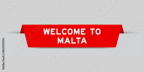 Red color inserted label with word welcome to malta on gray background
