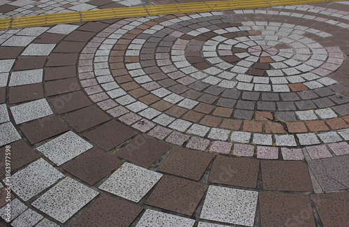 Wallpaper Mural Cobblestone and paving tile with yellow tactile tiles for blind handicap. Yellow tactile paving on walkway, guiding block for blind and visually impaired. Torontodigital.ca