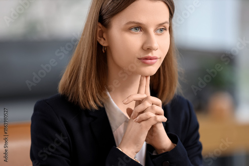 Thoughtful young businesswo...