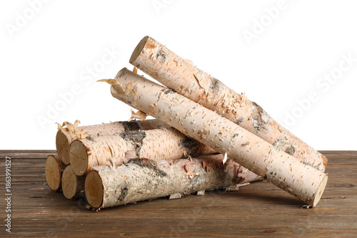 Stack of birch logs on wood...