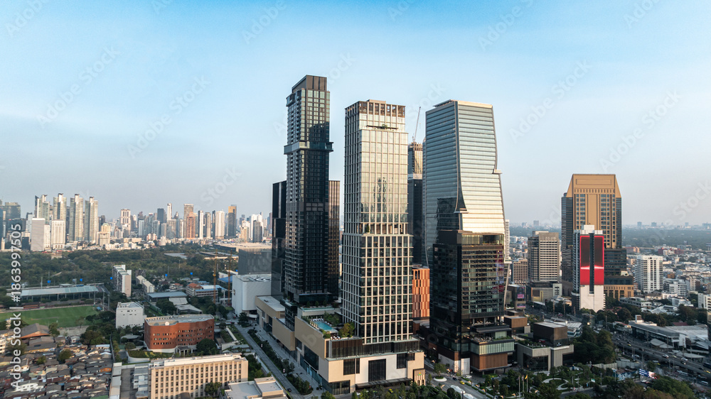 Fototapeta premium Modern City Skyline with High Rise Office Buildings and Business District Concept of corporate business, real estate development, urban growth, and modern metropolitan lifestyle